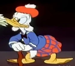 Image of a duck character from a disney short that bears resamblence to Scrooge McDuck. He's wearing a plaid kilt and a tammie cap leaning on a cane